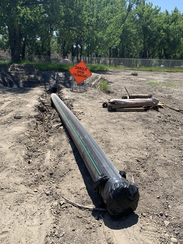 165 metres of sanitary force main and water line installed 15 metres under the riverbed.